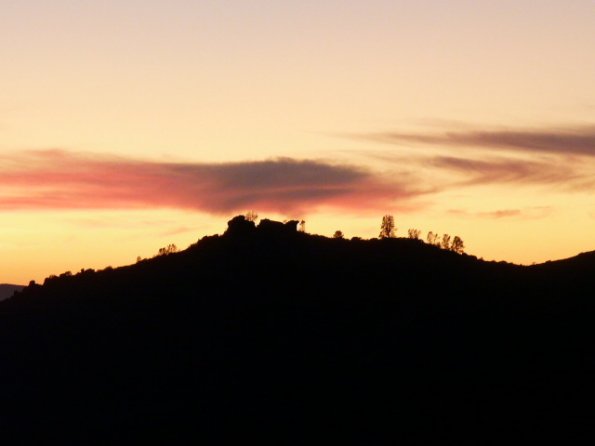 Sun behind the hill